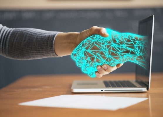 employee monitoring, monitoring employees online, hand coming from computer